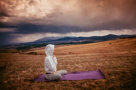 Image of a person meditating in a peaceful environment