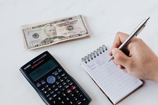 person creating a plan with a notepad