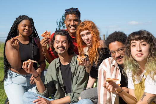 happy group of friends enjoying a picnic