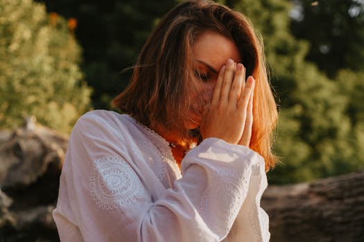 person meditating in nature