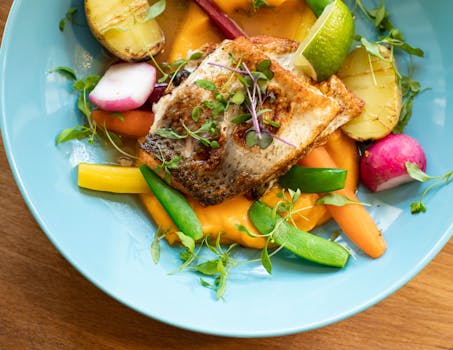 a plate of salmon and leafy greens